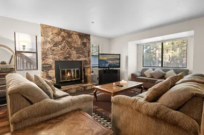a living room with two couches and a fireplace at Summit X-ross Roads - Just a short drive to the Village and the lake with forest views! in Big Bear Lake