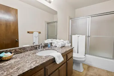 a bathroom with a sink and a toilet at Summit X-ross Roads - Just a short drive to the Village and the lake with forest views! in Big Bear Lake