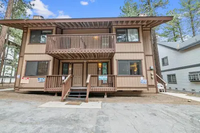 a large house with a large front porch at Summit X-ross Roads - Just a short drive to the Village and the lake with forest views! in Big Bear Lake