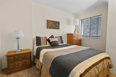 a bedroom with a large bed and a window at Summit X-ross Roads - Just a short drive to the Village and the lake with forest views! in Big Bear Lake