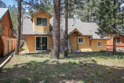 a house being constructed in the woods at Mountain Fever - Offers a Foosball Table and Barbecue Grill and a large back deck! in Big Bear Lake