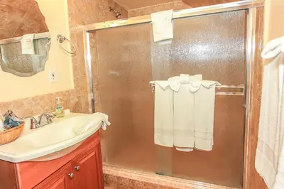 a bathroom with a shower and a sink at Mountain Fever - Offers a Foosball Table and Barbecue Grill and a large back deck! in Big Bear Lake