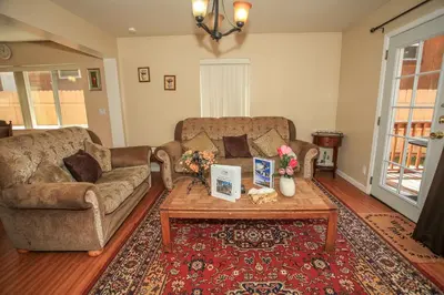 a living room with a couch and a coffee table at Mountain Fever - Offers a Foosball Table and Barbecue Grill and a large back deck! in Big Bear Lake