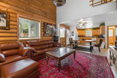 a living room with a couch and a table at Bear Bait - Lots of games, televisions, beds, telescope, and 3 bathrooms in Big Bear Lake