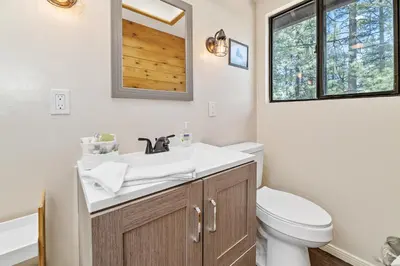 a bathroom with a sink and a toilet at Hidden Spot - Desirable Fox Farm area of Big Bear in Big Bear Lake