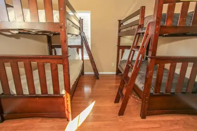 a room with four bunk beds in a room at Lakeview Court Castle - Short walk to the Village and lake in Big Bear Lake