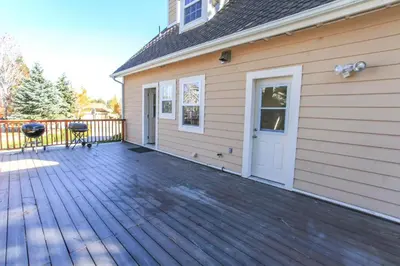 a porch of a house with a wooden deck at Lakeview Court Castle - Short walk to the Village and lake in Big Bear Lake
