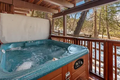 a jacuzzi tub on a deck at Snow Summit Thrush8 - Walk to Snow Summit Ski Resort in Big Bear Lake