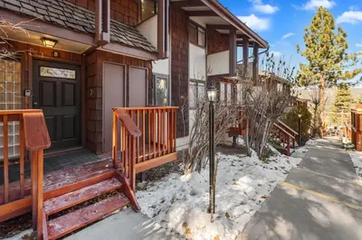 a house with a front porch with snow on the ground at Snow Summit Thrush8 - Walk to Snow Summit Ski Resort in Big Bear Lake