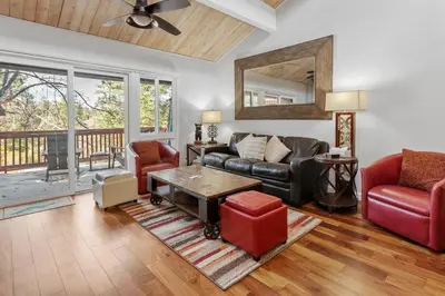 a living room with a couch and a table at Snow Summit Thrush8 - Walk to Snow Summit Ski Resort in Big Bear Lake