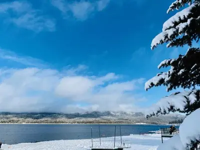 a view of a lake with snow on the ground at Summit Condo - Luxury condo, walk to the slopes! in Big Bear Lake