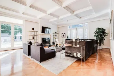 a living room with a couch and a table at Le Jardin in Los Angeles