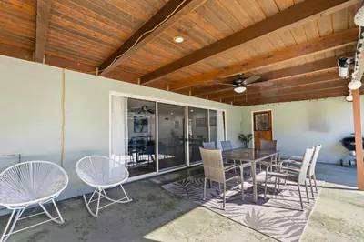 a dining room with a table and chairs at Spacious pool home in Pasadena in Pasadena