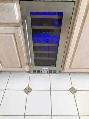 an oven in a kitchen with a tile floor at Beach House located in quiet community. in Oxnard
