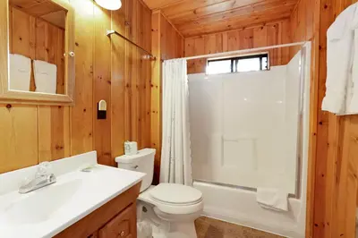 a bathroom with a toilet and a shower and a sink at Pine Nest Relaxing Walk to Marina Cozy Chalet in Big Bear Lake