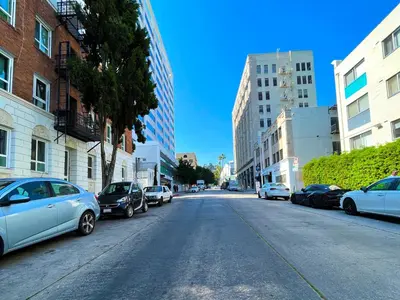 a street with cars parked on the sides of the road at Heart of Hollywood Apartment - 2Bed 2Bath in Los Angeles