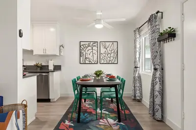 a kitchen and dining room with a table and chairs at East Village Arts District, King Suite with Sofa Bed NRP23-01221 in Long Beach