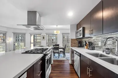 a kitchen with a sink and a stove top oven at Modern Luxury 2 Bed with Panoramic City Views in Downtown LA in Los Angeles
