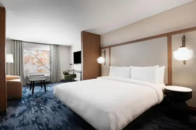 a large white bed in a hotel room at Fairfield by Marriott Inn & Suites Chino in Chino