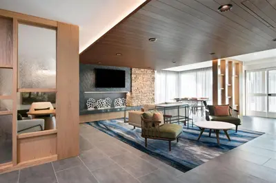 a living room filled with furniture and a tv at Fairfield by Marriott Inn & Suites Chino in Chino