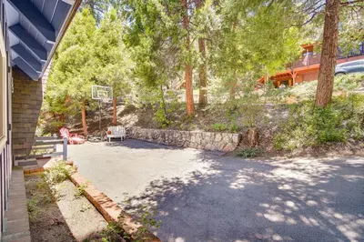 an empty driveway in front of a house at Steps to Lake Arrowhead Cabin with Full Lake Access in Lake Arrowhead