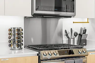 a kitchen with a stove and a microwave at #Marbella Lane - Panoramic Splendid Ocean Views! in Long Beach