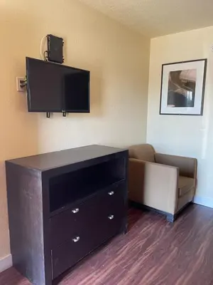 a living room with a couch and a flat screen tv at Cloud 9 in Cypress