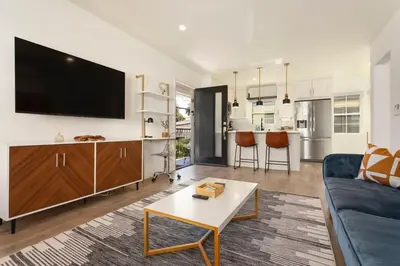 a living room with a couch and a tv at Downtown Culver City New Designer Lux 1 Bedroom in Los Angeles