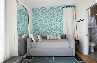 a living room with a couch in a room at Ocean View Hot Tub Luxe House Steps to Sand in Hermosa Beach