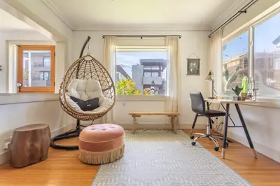 a room with a swing and a desk and a chair at Hermosa Bungalow 1920s Charm Steps to the Strand in Hermosa Beach