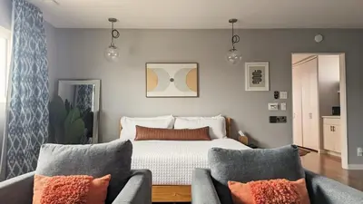 a bedroom with a bed and two couches at LA Huge Mid Century Guesthouse Patio LAX Beach in Los Angeles
