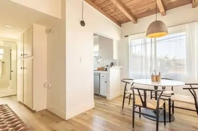 a kitchen and dining room with a table and chairs at Steps to Beach Manhattan Beach 2 Bedroom Parking in Manhattan Beach