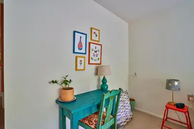 a room with a blue desk and a chair at Ojai Vacation Home with Views on the East End in Ojai