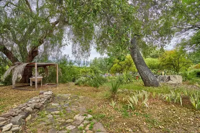 a garden with a gazebo under a tree at Ojai Vacation Home with Views on the East End in Ojai