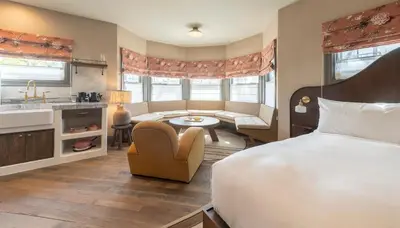 a hotel room with a large bed and a bathroom at Gjelina Hotel in Los Angeles