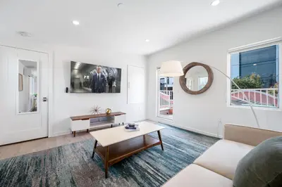 a living room with a couch and a table at Day Dreams by AvantStay in Los Angeles