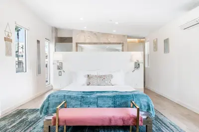 a bedroom with a large bed and two chairs at Day Dreams by AvantStay in Los Angeles
