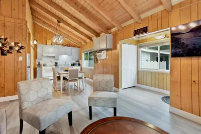 a kitchen and dining room with a table and chairs at Sweet Retreat 1- Cozy Relaxing Resort Cabin in Big Bear Lake