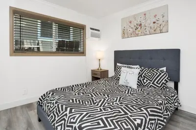 a bedroom with a bed and a window at Sweet Retreat 2- Cozy Relaxing Resort Cottage in Big Bear Lake