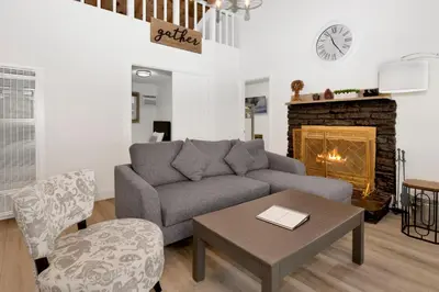 a living room with a couch and a fireplace at Sweet Retreat 2- Cozy Relaxing Resort Cottage in Big Bear Lake