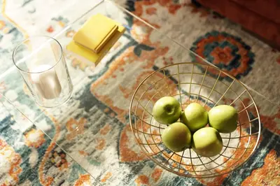 a bowl of green apples on a table with a plate of cheese at Lux Oasis in West Hollywood, Free Parking & Swimming pool in Los Angeles