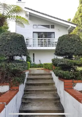 a stairway leading up to a white house at Large Luxury Studio with View in Santa Monica in Santa Monica