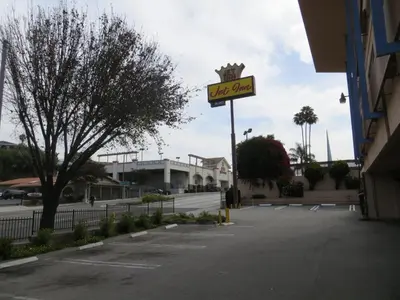 a sign for a wig store in a parking lot at Jet Inn in Los Angeles