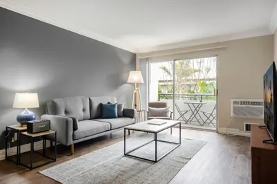 a living room with a couch and a table at Westside 1BR w Pool Gym Bball Tennis Courts LAX-85 in Los Angeles