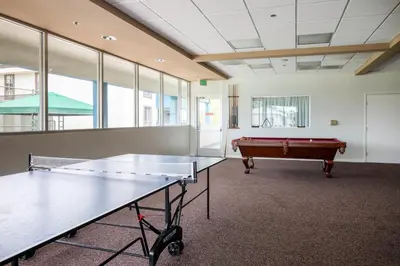 a ping pong table in a room with a pool table at Westside 1BR w Pool Gym Bball Tennis Courts LAX-85 in Los Angeles