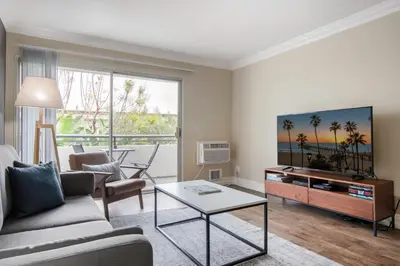 a living room with a couch and a table at Westside 1BR w Pool Gym Bball Tennis Courts LAX-85 in Los Angeles