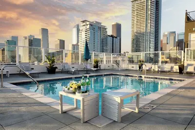 a pool on the roof of a building at NYC Styled Loft In DTLA, sleeps 4 with Free Parking! in Los Angeles