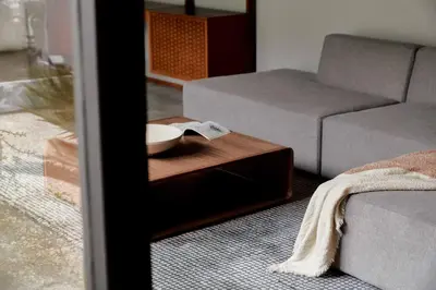 a living room with a couch and a coffee table at Eichler Mid Century Modern Designer Pool/Jacuzzi in Thousand Oaks