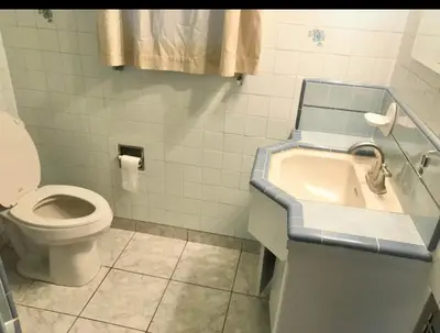 a bathroom with a sink and a toilet at Room in Monterey Park CA in Monterey Park