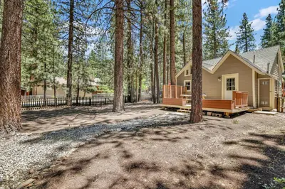 a home in the woods with a house at Moonridge R n R- Cozy Single Level Central Chalet Home in Big Bear Lake